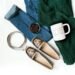 Neutral fall wardrobe pieces and footwear arranged for a capsule wardrobe