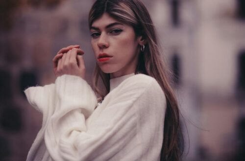 Woman in a white sweater for fall styling inspiration; not a specific product. Photo by mhajr invincible via Unsplash.