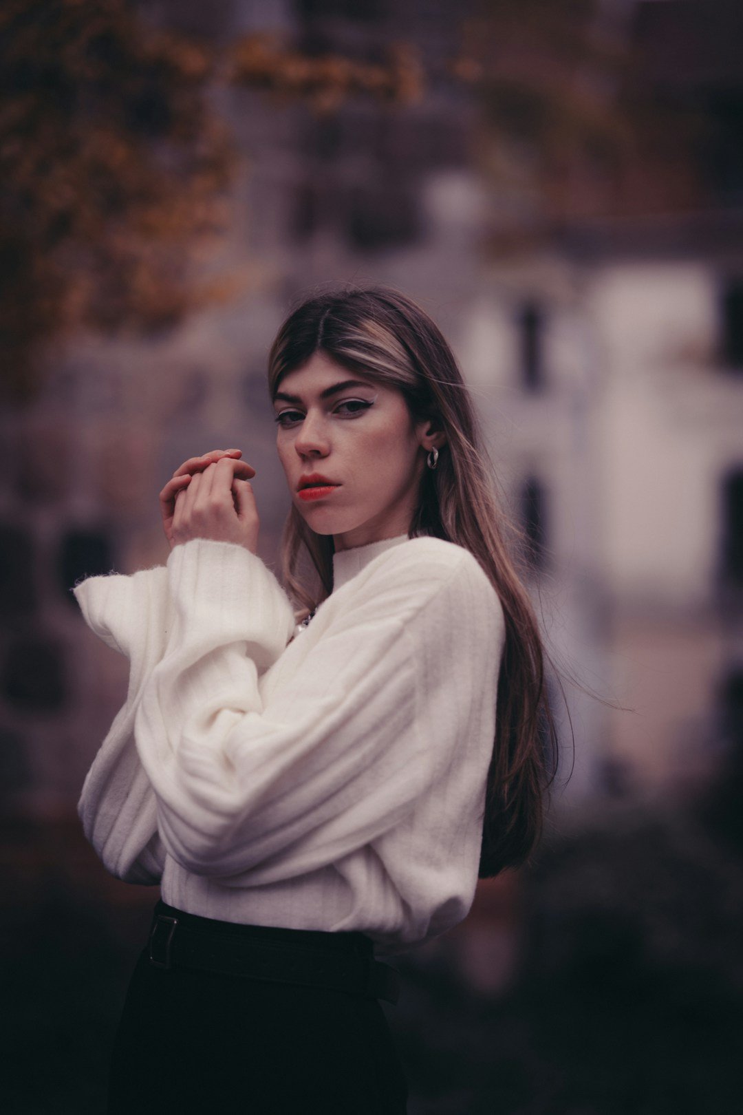 Woman in a white sweater for fall styling inspiration; not a specific product. Photo by mhajr invincible via Unsplash.